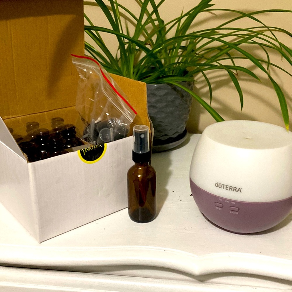 Essential oil diffuser and new empty spray bottles